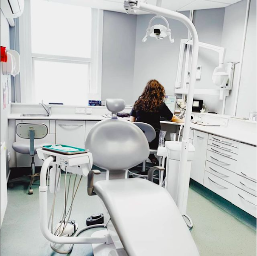 MK Dental and Implant Clinic logo